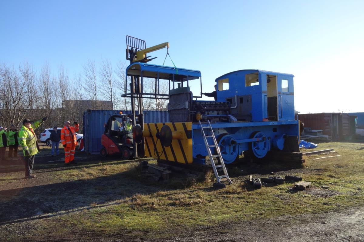 Bonnet being lowered into place.