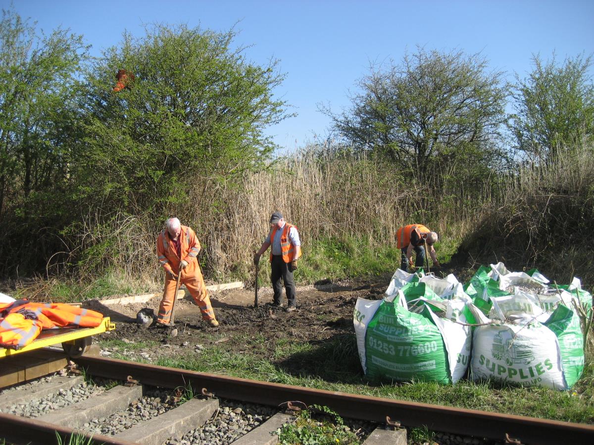 Clearing out the path of plant growth.